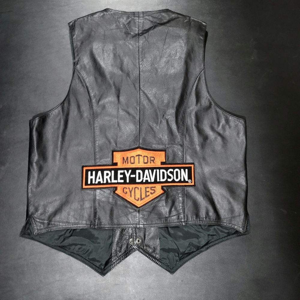 Leather motorcycle vest with Harley Davidson patch stitched on.
